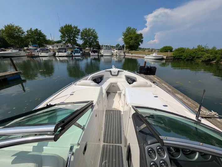  Yacht Photos Pics 2011 Monterey 328 SS boat docked in a serene marina setting.