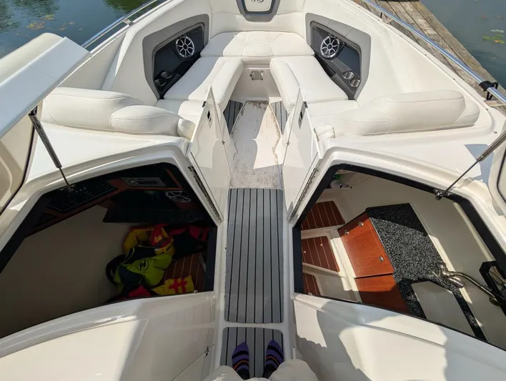  Yacht Photos Pics 2011 Monterey 328 SS boat interior with seating, speakers, and storage compartments.