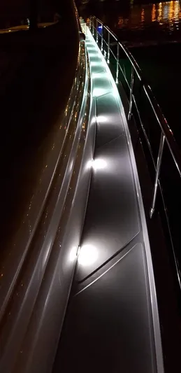 Uml Yacht Photos Pics Illuminated deck of a 2007 Pershing 62' yacht at night.