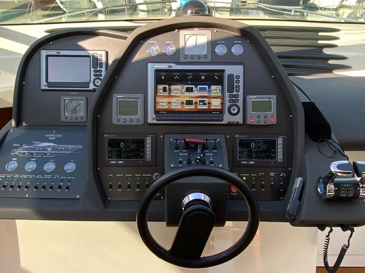 Uml Yacht Photos Pics Cockpit of 2007 Pershing 62' yacht with advanced navigation controls and displays.
