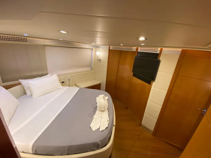 Uml Yacht Photos Pics Luxurious bedroom interior of 2007 Pershing 62' yacht with modern amenities and elegant design.