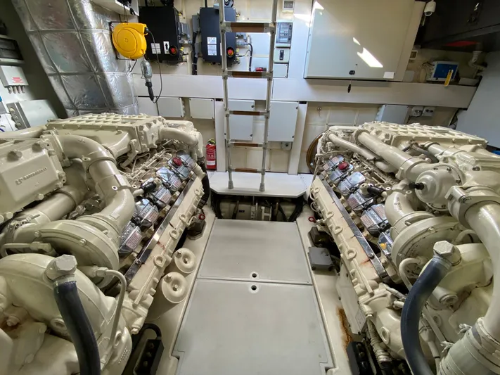 Uml Yacht Photos Pics Engine room of a 2007 Pershing 62' yacht, featuring dual powerful engines.