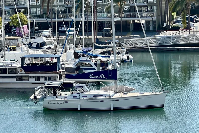 The Jonathan Shepard Yacht Photos Pics Sailboat Hanse 461e, 2006 model, docked in a marina with other boats.