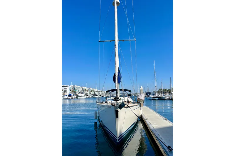 The Jonathan Shepard Yacht Photos Pics 2006 Hanse 461e sailboat docked in a sunny marina, clear blue sky.