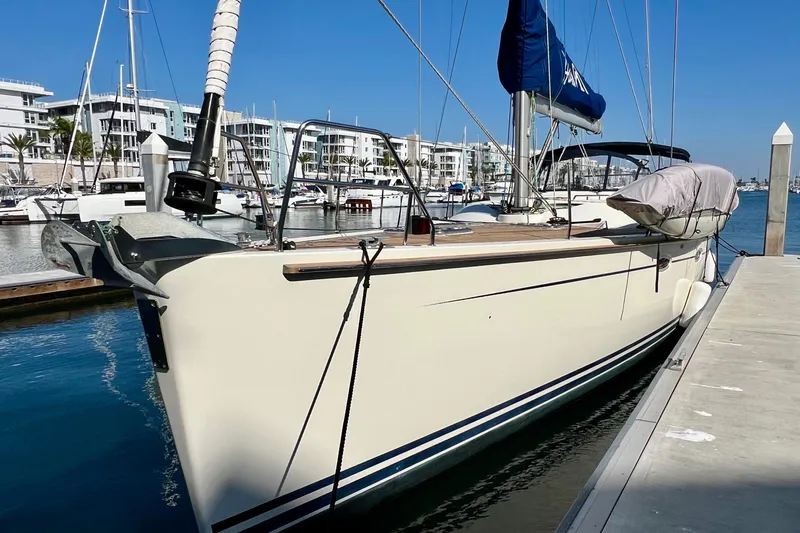 The Jonathan Shepard Yacht Photos Pics 2006 Hanse 461e sailboat docked in a marina, clear blue sky background.