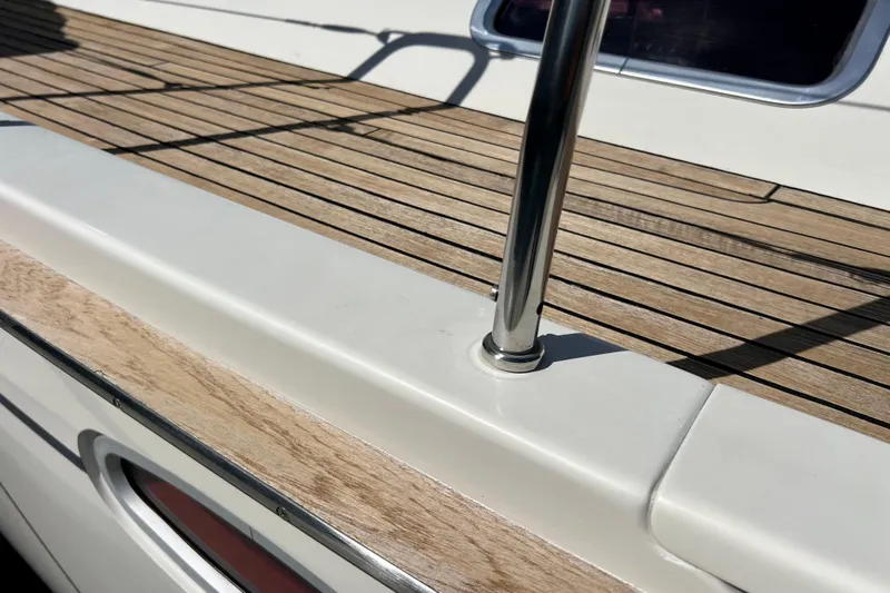 The Jonathan Shepard Yacht Photos Pics Teak deck of 2006 Hanse 461e yacht with stainless steel railing.