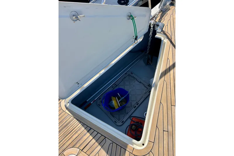 The Jonathan Shepard Yacht Photos Pics Open storage compartment on 2006 Hanse 461e yacht deck with tools and equipment.