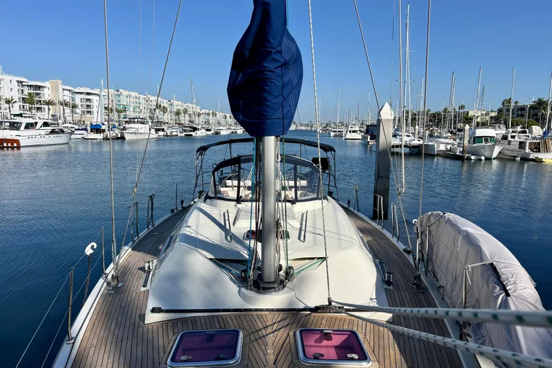 The Jonathan Shepard Yacht Photos Pics 2006 Hanse 461e yacht docked in a marina, surrounded by other boats under a clear blue sky.