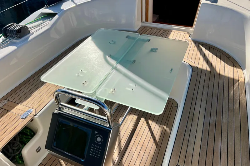 The Jonathan Shepard Yacht Photos Pics Cockpit of 2006 Hanse 461e yacht with glass table and navigation equipment.