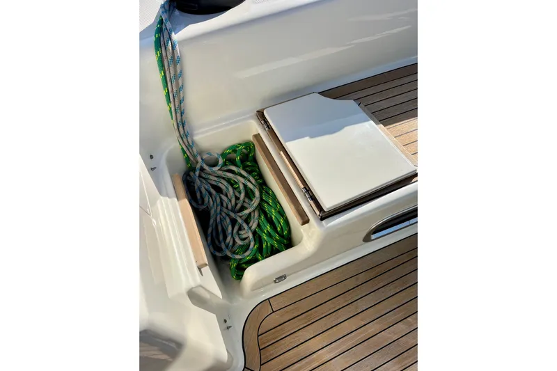 The Jonathan Shepard Yacht Photos Pics Coiled ropes on deck of 2006 Hanse 461e yacht, featuring teak flooring.