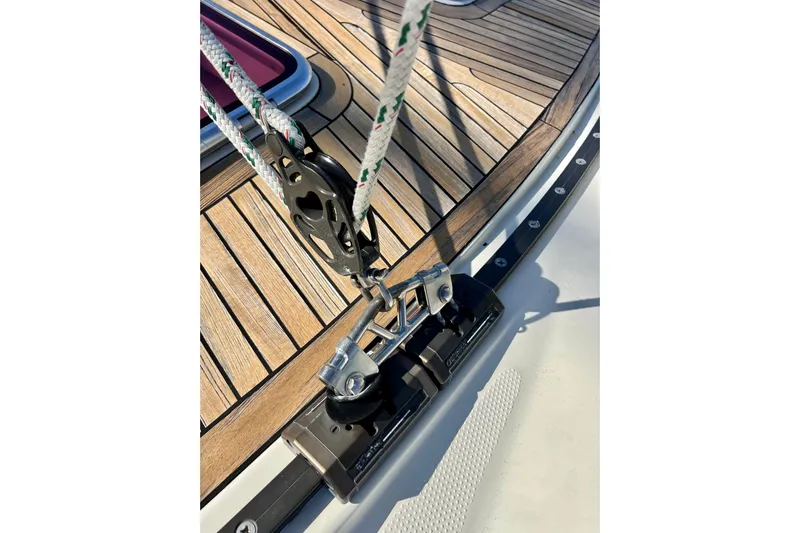 The Jonathan Shepard Yacht Photos Pics Close-up of 2006 Hanse 461e sailboat deck with rigging and wooden finish.