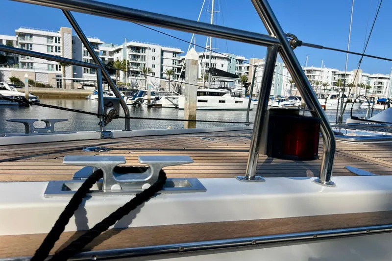 The Jonathan Shepard Yacht Photos Pics Deck view of 2006 Hanse 461e yacht in a marina with modern buildings.