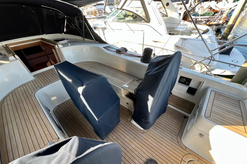 The Jonathan Shepard Yacht Photos Pics Spacious cockpit of 2006 Hanse 461e yacht with covered seating and wooden deck.