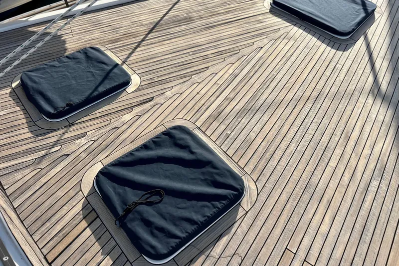 The Jonathan Shepard Yacht Photos Pics Teak deck of 2006 Hanse 461e yacht with covered hatches.