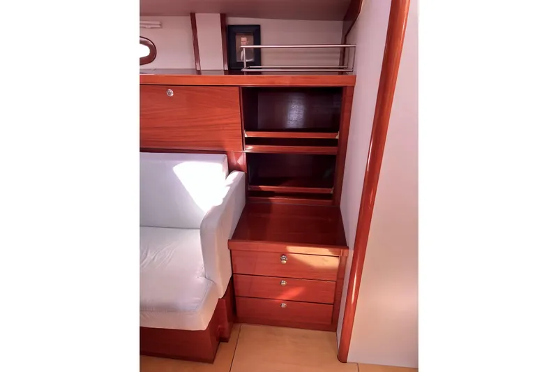 The Jonathan Shepard Yacht Photos Pics Interior of 2006 Hanse 461e yacht with wooden cabinetry and white seating.