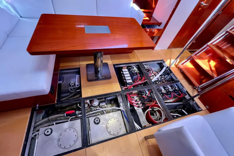 The Jonathan Shepard Yacht Photos Pics Interior of 2006 Hanse 461e yacht showing open floor panels with wiring and components.