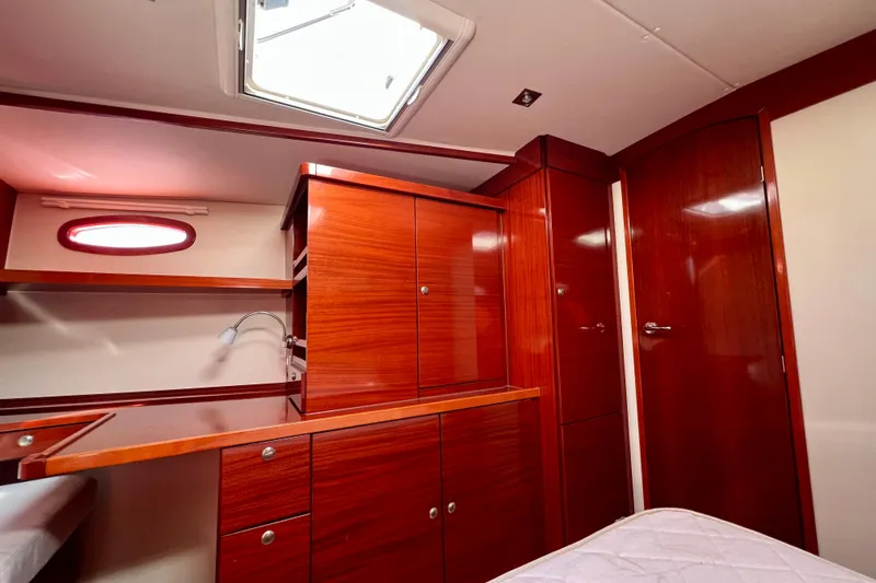 The Jonathan Shepard Yacht Photos Pics Luxurious wooden interior of 2006 Hanse 461e yacht cabin with ample storage.