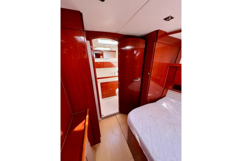 The Jonathan Shepard Yacht Photos Pics Luxurious 2006 Hanse 461e yacht interior with polished wood finish and cozy cabin.