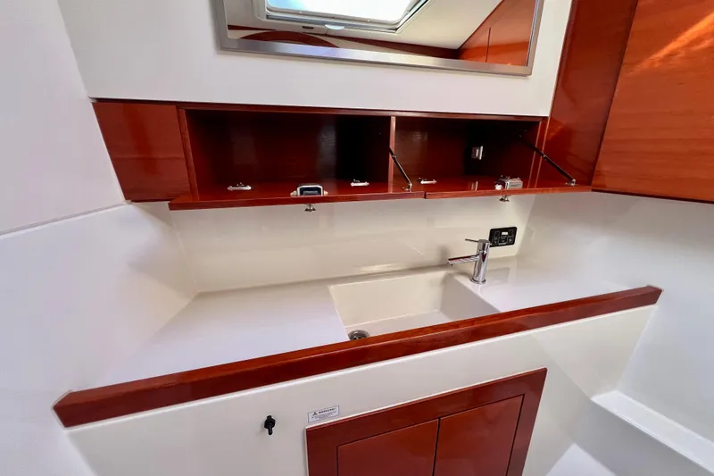 The Jonathan Shepard Yacht Photos Pics Modern yacht interior with sleek wooden cabinetry and a compact sink, Hanse 461e, 2006 model.