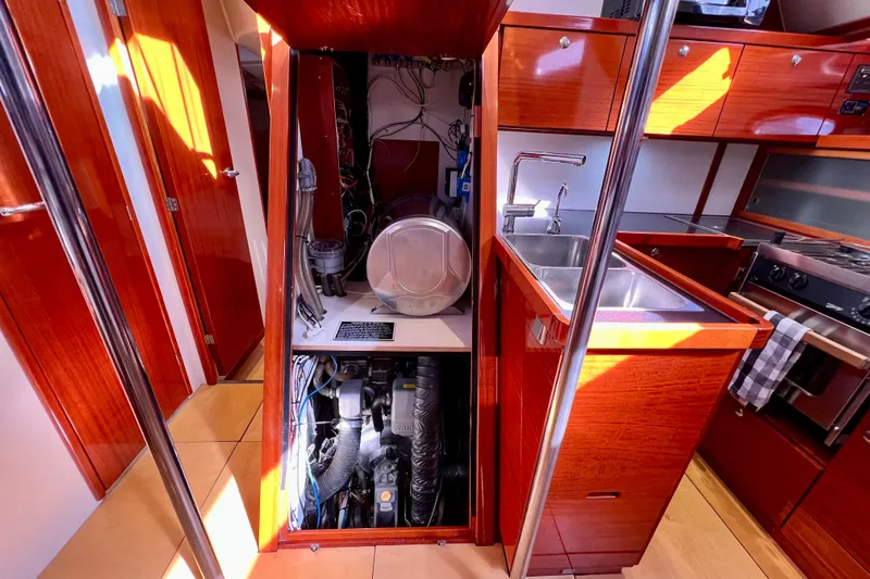 The Jonathan Shepard Yacht Photos Pics Interior of 2006 Hanse 461e yacht showing engine compartment and kitchen area.