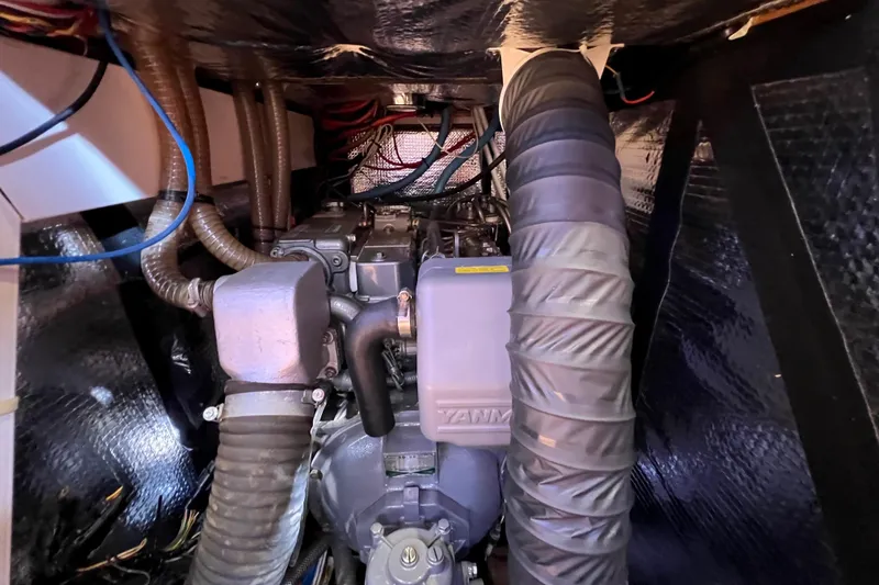 The Jonathan Shepard Yacht Photos Pics Engine compartment of a 2006 Hanse 461e sailboat, featuring Yanmar components.
