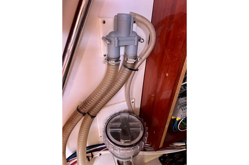 The Jonathan Shepard Yacht Photos Pics Boat plumbing system in a 2006 Hanse 461e, featuring hoses and fittings.