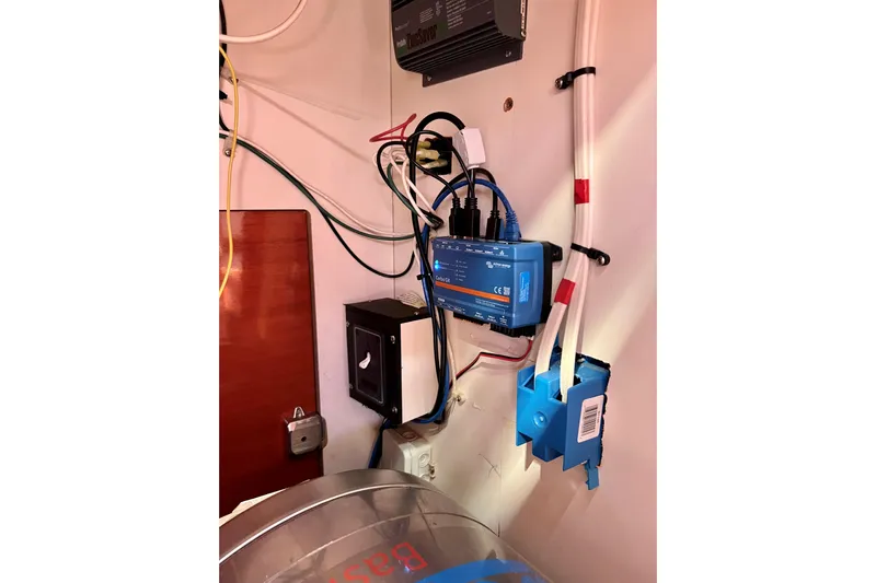 The Jonathan Shepard Yacht Photos Pics Electrical setup inside a 2006 Hanse 461e yacht, featuring wiring and devices.