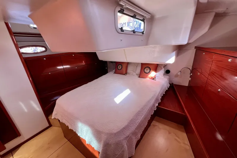 The Jonathan Shepard Yacht Photos Pics Luxurious cabin interior of 2006 Hanse 461e yacht with elegant wood finish.