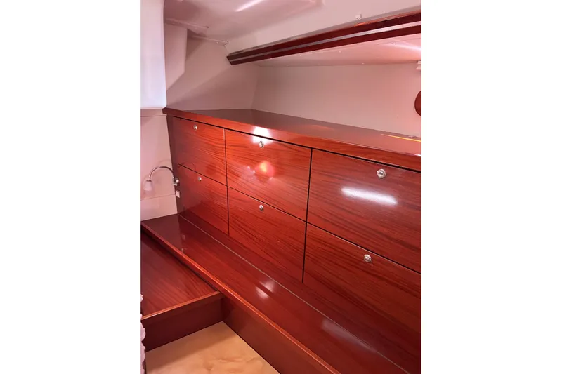 The Jonathan Shepard Yacht Photos Pics Luxurious wooden cabinetry inside a 2006 Hanse 461e yacht, showcasing sleek design and ample storage.