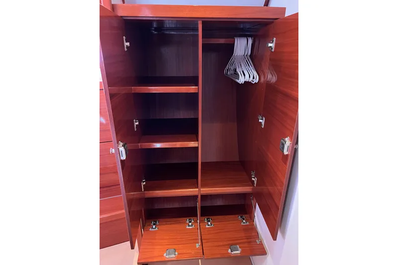 The Jonathan Shepard Yacht Photos Pics Wooden wardrobe with shelves and hangers, Hanse 461e, 2006 model.