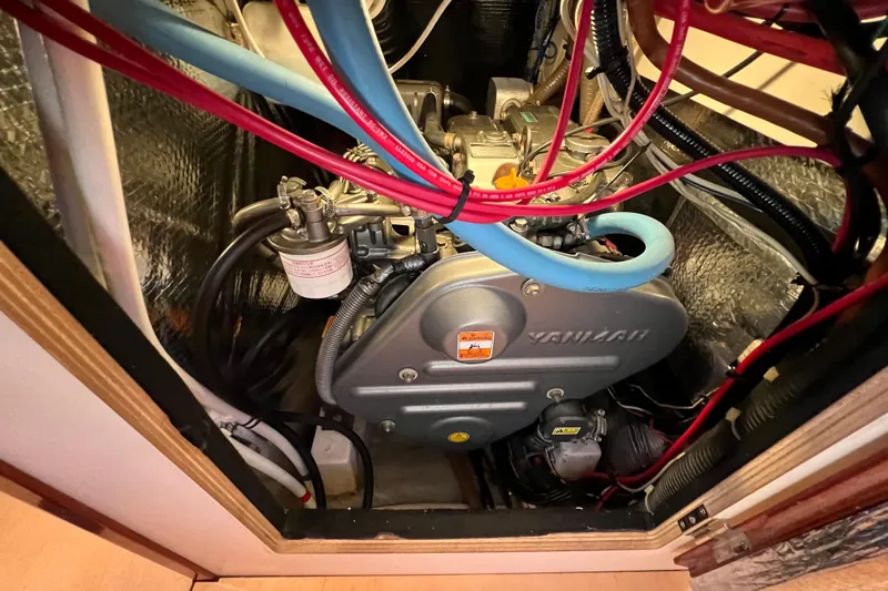 The Jonathan Shepard Yacht Photos Pics Engine compartment of a 2006 Hanse 461e sailboat with visible Yanmar engine components.