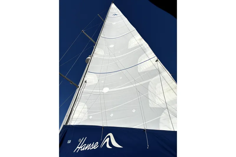 The Jonathan Shepard Yacht Photos Pics Sail of a 2006 Hanse 461e yacht against a clear blue sky.