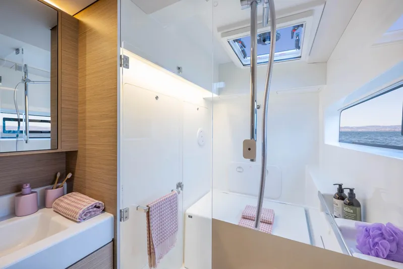  Yacht Photos Pics Modern bathroom interior of 2026 Lagoon 38 yacht with ocean view.