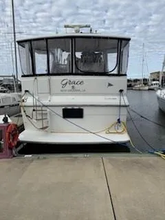 Grace Yacht Photos Pics 1995 Carver 440 Aft Cabin Motor Yacht docked at marina, rear view.