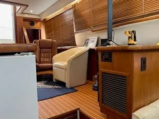 Grace Yacht Photos Pics Interior of 1995 Carver 440 Aft Cabin Motor Yacht with wood paneling and leather seating.