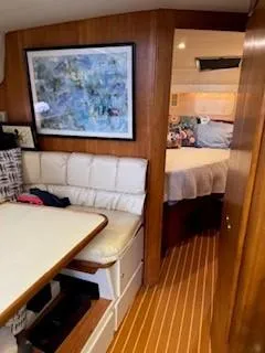 Grace Yacht Photos Pics Interior of 1995 Carver 440 Aft Cabin Motor Yacht with seating and bedroom.