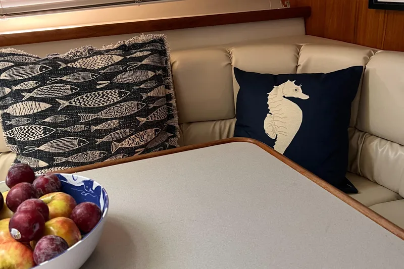 Grace Yacht Photos Pics Cozy interior of 1995 Carver 440 Yacht with decorative pillows and fruit bowl.