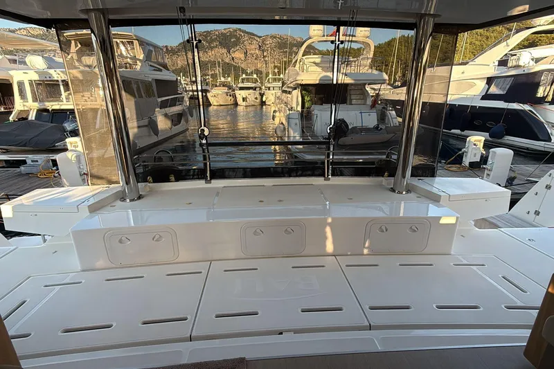  Yacht Photos Pics Luxurious 2021 Bali 5.4 yacht interior with marina view, showcasing sleek design and spacious layout.