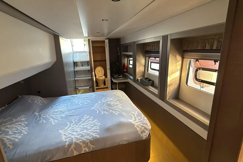 Yacht Photos Pics Luxurious Bali 5.4 yacht bedroom interior, 2021 model, featuring a cozy bed and modern amenities.