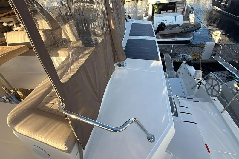  Yacht Photos Pics Modern Bali 5.4 yacht deck with seating and marina view, 2021 model.