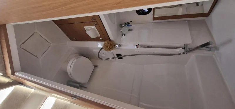  Yacht Photos Pics 2024 Bali 5.4 yacht bathroom with shower, toilet, and wooden accents.