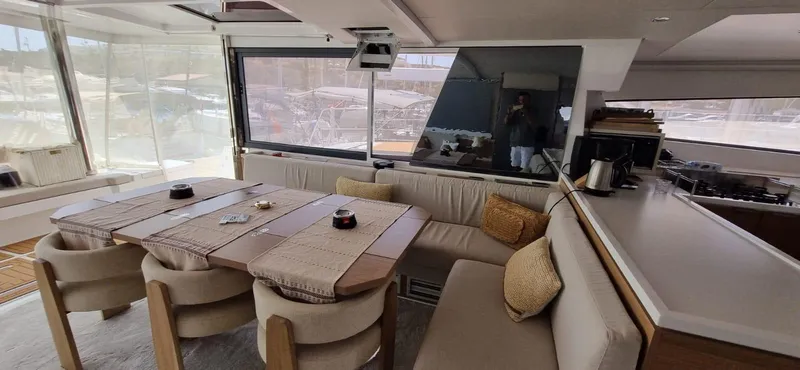  Yacht Photos Pics Luxurious interior of 2024 Bali 5.4 yacht with elegant dining area and modern kitchen.