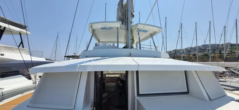  Yacht Photos Pics 2024 Bali 5.4 yacht docked at marina, showcasing sleek design and modern features.