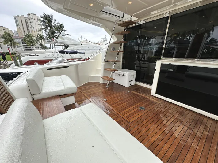 Primo Yacht Photos Pics Luxurious 2014 Ferretti Yachts 530 with elegant teak deck and modern seating area.