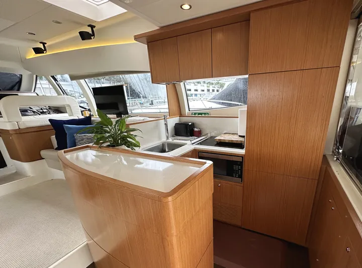 Primo Yacht Photos Pics Luxurious 2014 Ferretti Yachts 530 interior with modern kitchen and elegant wood finishes.