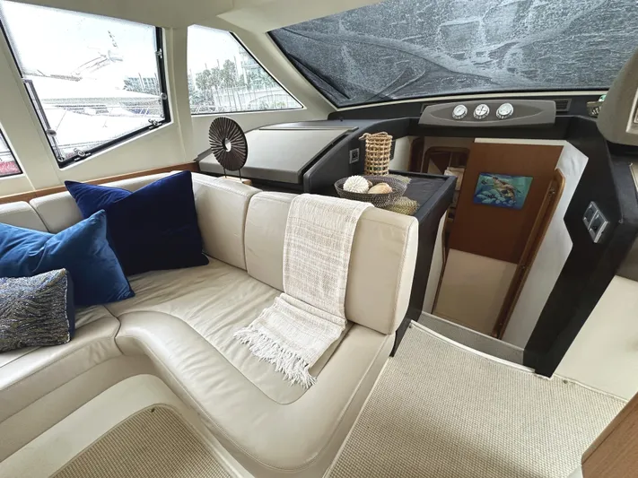 Primo Yacht Photos Pics Luxurious interior of 2014 Ferretti Yachts 530 with plush seating and elegant decor.