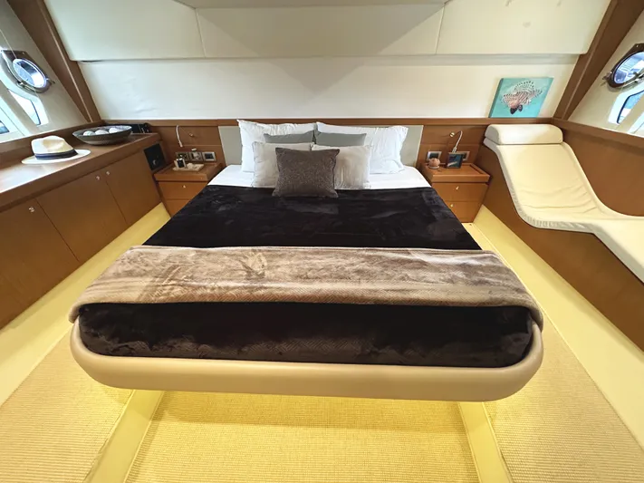 Primo Yacht Photos Pics Luxurious bedroom interior of 2014 Ferretti Yachts 530 with elegant furnishings.