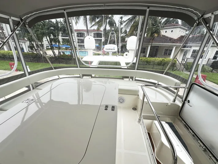 Primo Yacht Photos Pics Ferretti Yachts 530, 2014 model, spacious deck with canopy and modern amenities.