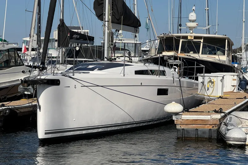  Yacht Photos Pics 2023 Beneteau First 36 sailboat docked at marina, sleek design, sunny day.