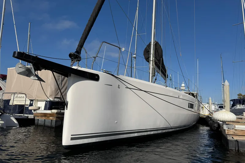  Yacht Photos Pics 2023 Beneteau First 36 sailboat docked at marina under clear blue sky.